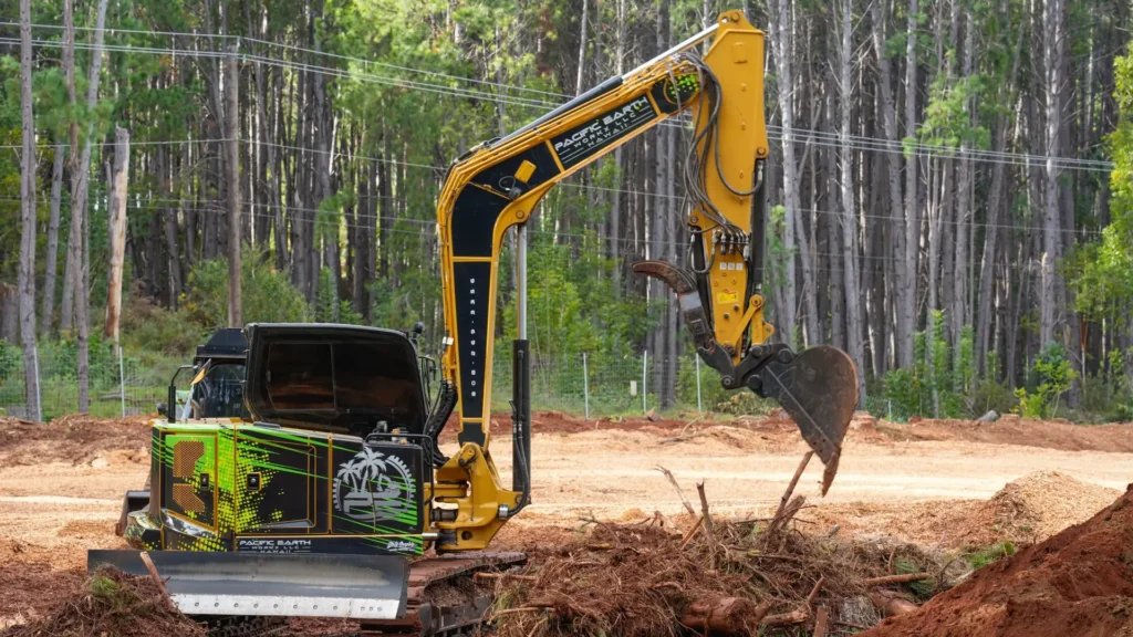 Excavator clearing land on Maui
